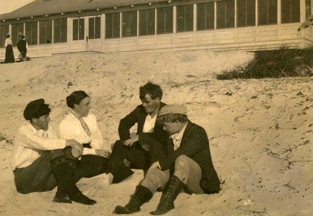 Picture of George Sterling, Mary Austen, Jack London, and Jimmy Hopper on the sand at Carmel.
